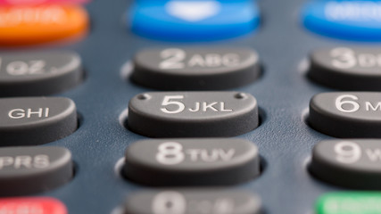 Fototapeta premium Macro buttons on a banking terminal. Keyboard of a banking terminal close-up.