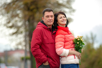 Mature couple. Mature couple with a bouquet of flowers.