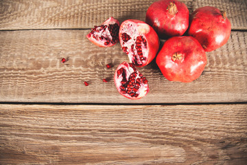 Fototapeta na wymiar pomegranates on the wooden table