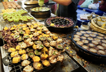 Khanom Khrok (coconut rice pancake), Traditional Thai Dessert at street food market.      