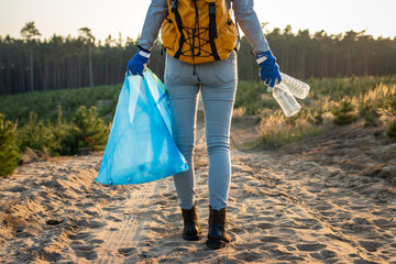 Keep the nature without plastic pollution! Volunteer cleaning forest from plastic garbage
