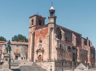 Fototapeta na wymiar TRUJILLO, EXTREMADURA, SPAIN - AUGUST 08, 2019: Saint Martin´s Church. Tourists in the architectural and monumental complex of the ancient and picturesque streets of Trujillo