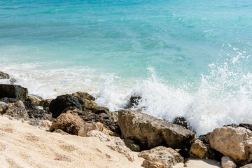 Rocly coast line of Atlantic Ocean. Gorgeous white foamy waves and turquoise water. Beautiful natute landscape backgrounds.
