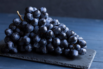 blue grapes on a stone board  B