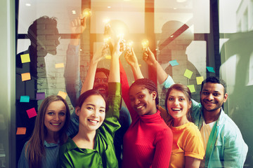 Teamwork and brainstorming concept with businessmen that share an idea with a lamp. Concept of...