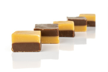 Group of five whole sweet brown caramel chocolate candy isolated on white background