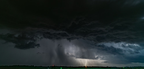 lightning behind rain