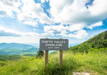 Scenic drive from Curtis Valley Overlook elevation 4460 ft. on Blue Ridge Parkway, Blue sky background with cloudy