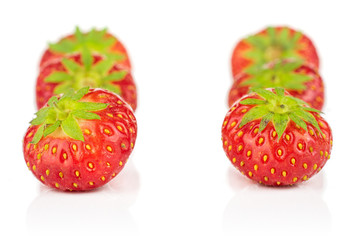 Group of six whole fresh red strawberry isolated on white background