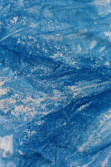 The fabric indigo tie dye as a background and texture.