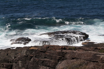 waves crashing on rocks
