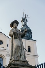 Fototapeta na wymiar Entrance to the basilica of St. Mary. Kalwaria Zebrzydowska, Poland. Sculpture, details