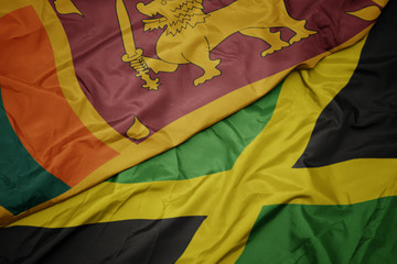 waving colorful flag of jamaica and national flag of sri lanka.