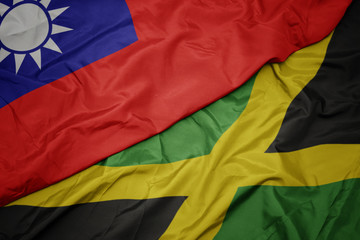 waving colorful flag of jamaica and national flag of taiwan.