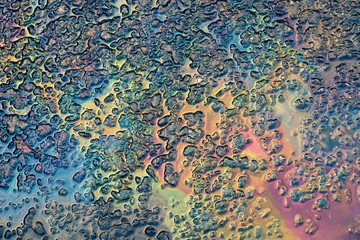 spilled gasoline on the pavement