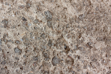 old stone surface, interspersed with stones