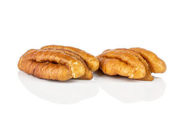 Group of two whole dry brown pecan nut isolated on white background
