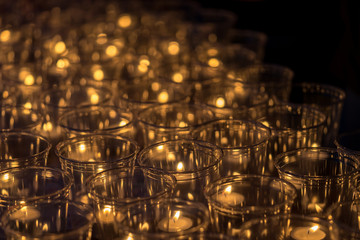 Tea light candles in plastic cups for night celebration event