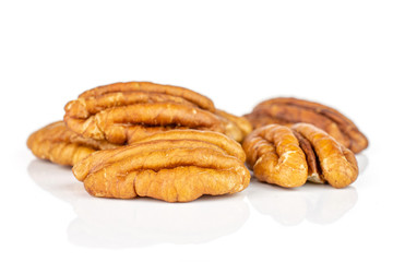 Group of five whole dry brown pecan nut isolated on white background