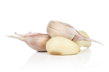 Group of four pieces of aromatic white garlic isolated on white background