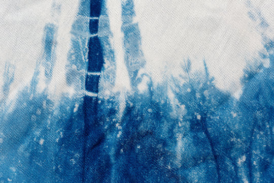 The fabric indigo tie dye as a background and texture.