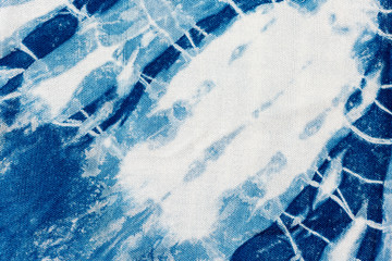 The fabric indigo tie dye as a background and texture.