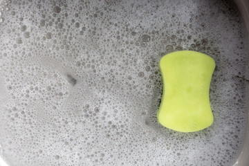 Sponge with bubbles in the sink.