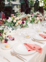 Table settings for a luxury wedding reception. Outdoor wedding