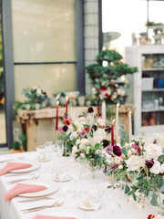 Table settings for a luxury wedding reception. Outdoor wedding