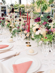 Table settings for a luxury wedding reception. Outdoor wedding