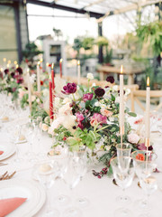 Table settings for a luxury wedding reception. Outdoor wedding