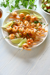 Prawns skewers with sauce