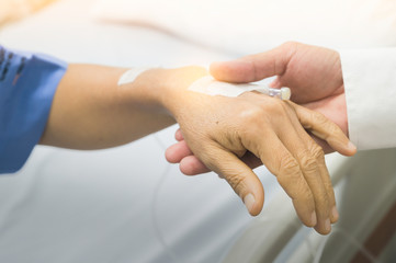Holding hands Asian senior or elderly old lady woman patient with love, care, encourage and empathy at nursing hospital ward : healthy strong medical concept