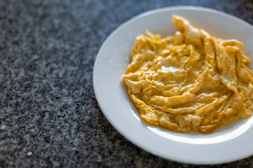  plate with a typical omelet. omelet with asparagus in a pan on dish.