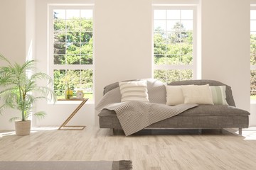 Stylish room in white color with sofa and summer landscape in window. Scandinavian interior design. 3D illustration