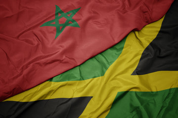 waving colorful flag of jamaica and national flag of morocco.