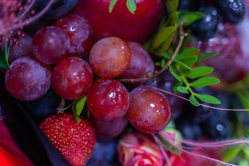Bright beautiful stew of fruits and flowers close-up