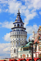Fototapeta premium Izmailovsky Kremlin colorful tower in Moscow, Russia. Famous entertainment center and old town market on summer day