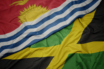 waving colorful flag of jamaica and national flag of Kiribati .