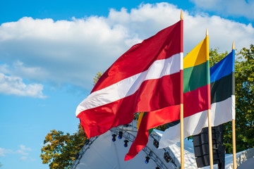 Latvian, Lithuanian and Estonian flags waving together, Latvia, Lithuania, Estonia, Baltic countries, united, independent  - obrazy, fototapety, plakaty