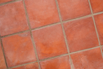 terracotta tiled floor background - terracotta tiles closeup -