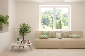Stylish room in white color with sofa and summer landscape in window. Scandinavian interior design. 3D illustration