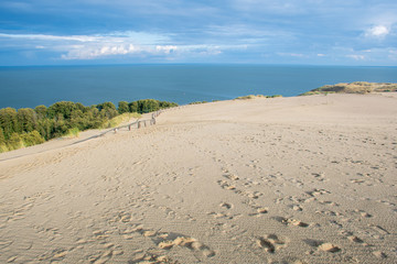 Panoramic view of sand dunes in Nida, Klaipeda, Lithuania, Europe. Curonian Spit and Curonian Lagoon, with reeds. Baltic Dunes. Unesco heritage