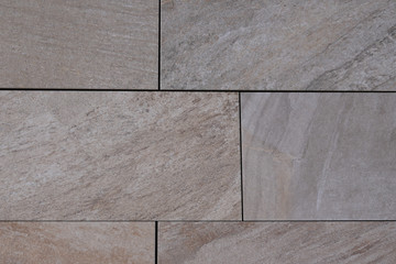 floor pattern from stone slabs beige background