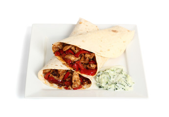 Tortilla with chicken, bell pepper and tzatziki. Isolated with c