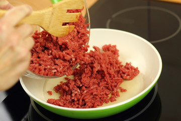 Adding ground beef into frying pan