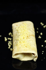 Tortilla on cooking sheet ready for baking