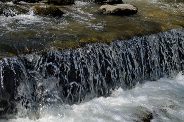 View of waterfall in river Bistritsa by village Pancharevo, place for tourism and travel in Vitosha...