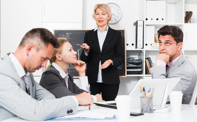 Businesswoman feeling angry to coworkers
