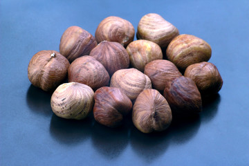 hazelnut handful close-up on a dark plate